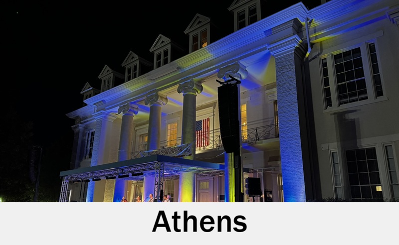 Historic Athens, Alabama building illuminated for an evening celebration