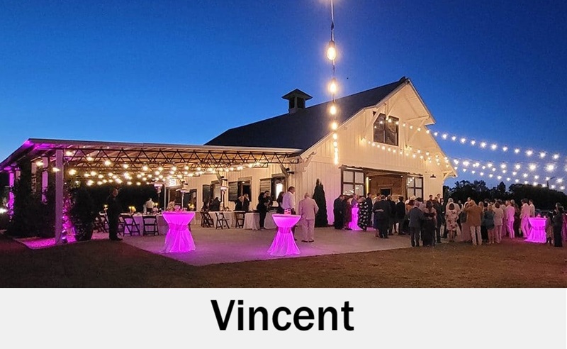 Vincent, Alabama barn venue lit for evening wedding reception